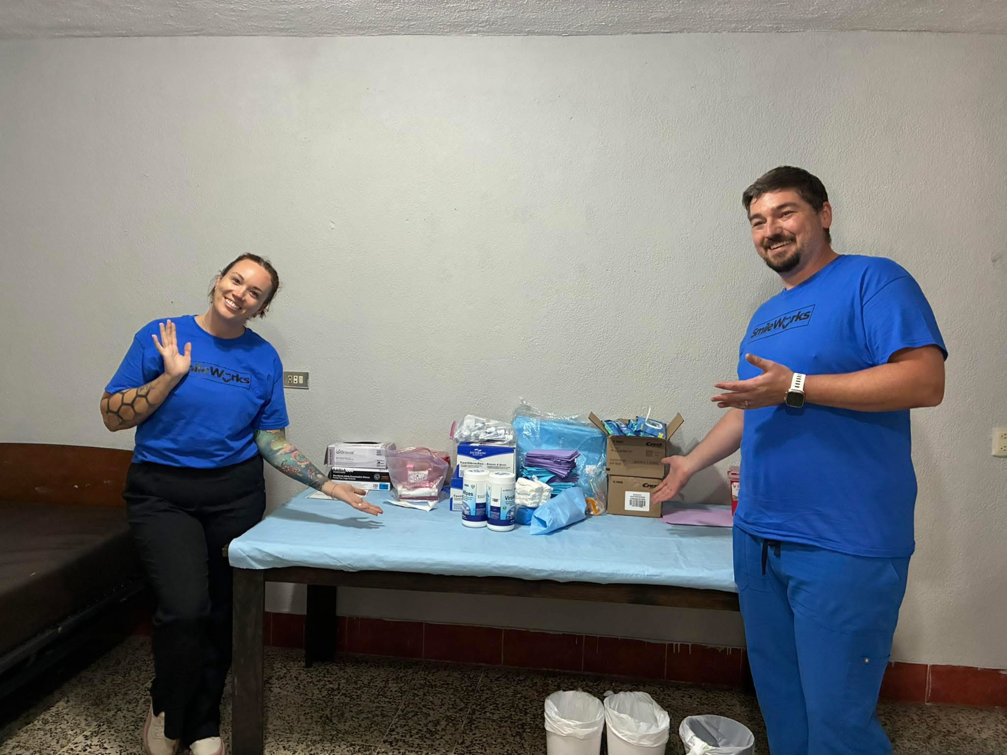 SmileWorks volunteers presenting dental supplies